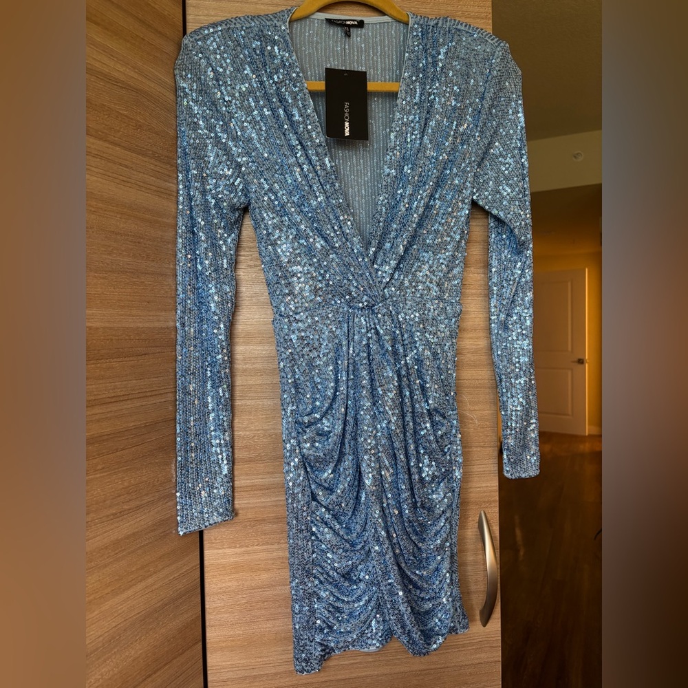 Blue Sequin Dress with a deep V neck. New with tag.
